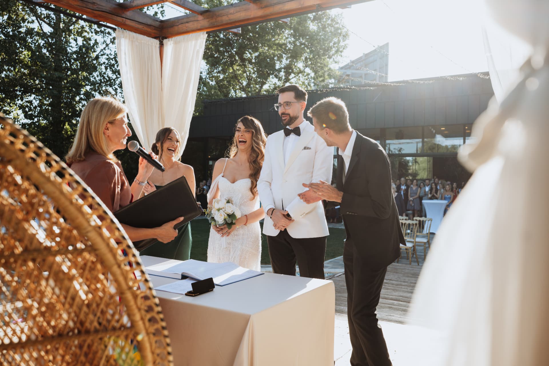 Bride and groom laughing with the officiant and witnesses during the outdoor ceremony at Verde Open Concept, Belgrade
