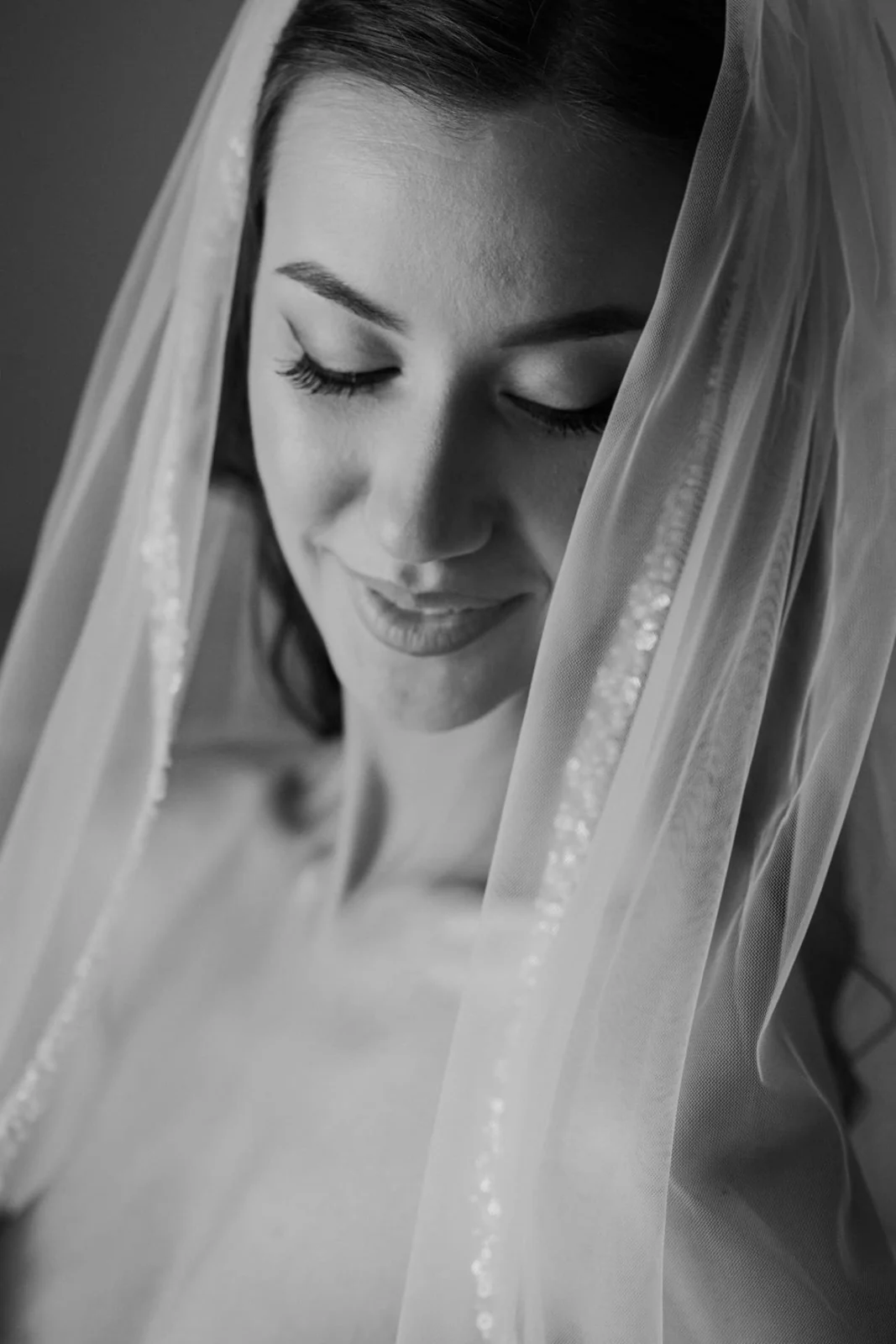 Black and white editorial bridal portrait with wedding veil by Nemanja Potkonjak.